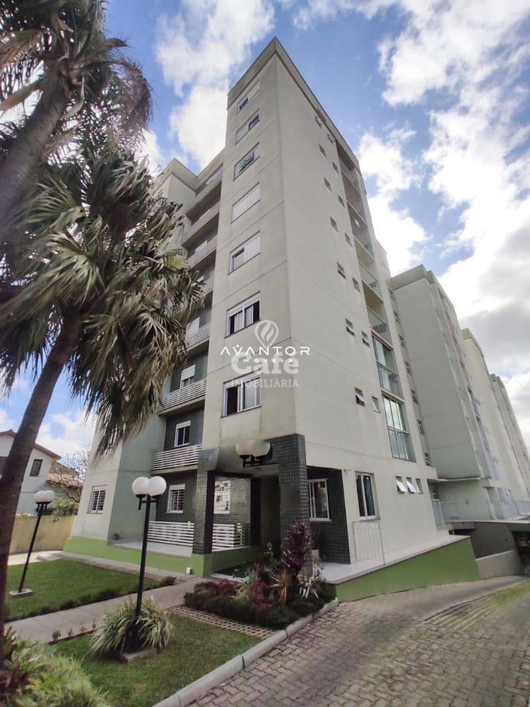 Fachada do prédio com palmeira — Apartamento com 2 quartos à venda no Residencial Nogueiras, em Bonfim, Santa Maria/RS