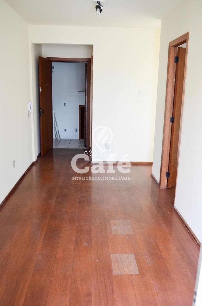 Hall de entrada com piso em madeira — Apartamento com 1 quarto à venda em Nossa Senhora de Fátima, Santa Maria/RS