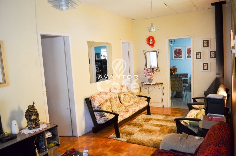 Sala de estar com sofá e piso de madeira — Apartamento com 10 quartos à venda em Centro, Santa Maria/RS