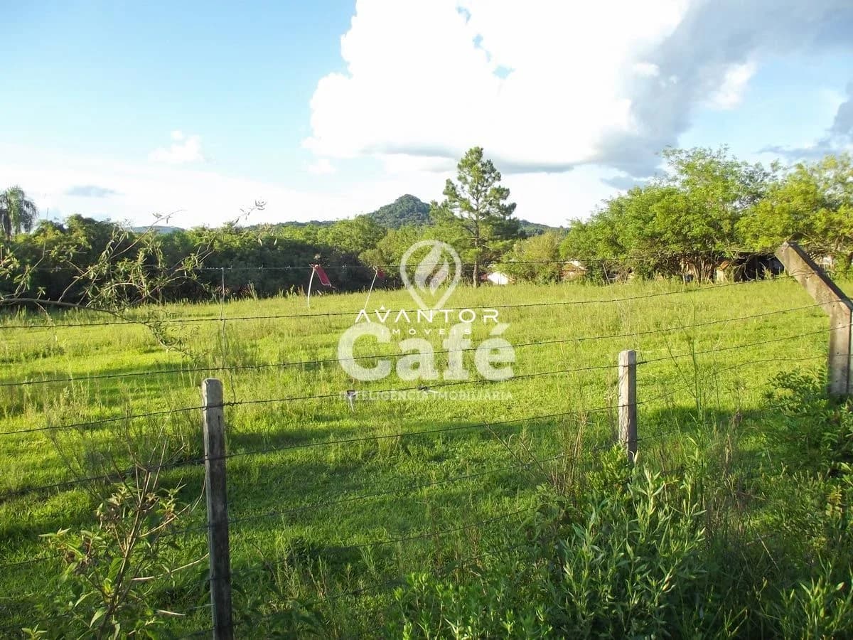 Terreno com cerca e vegetação — Terreno à venda em Diácono João Luiz Pozzobon, Santa Maria/RS