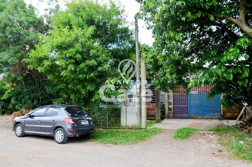 Fachada com garagem e acesso à propriedade — Terreno à venda em Boi Morto, Santa Maria/RS