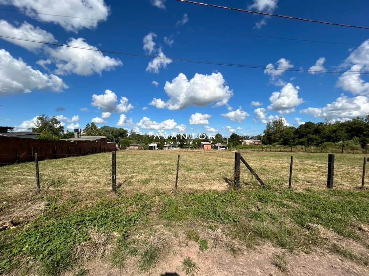 Terreno com cerca de madeira — Terreno à venda em Diácono João Luiz Pozzobon, Santa Maria/RS