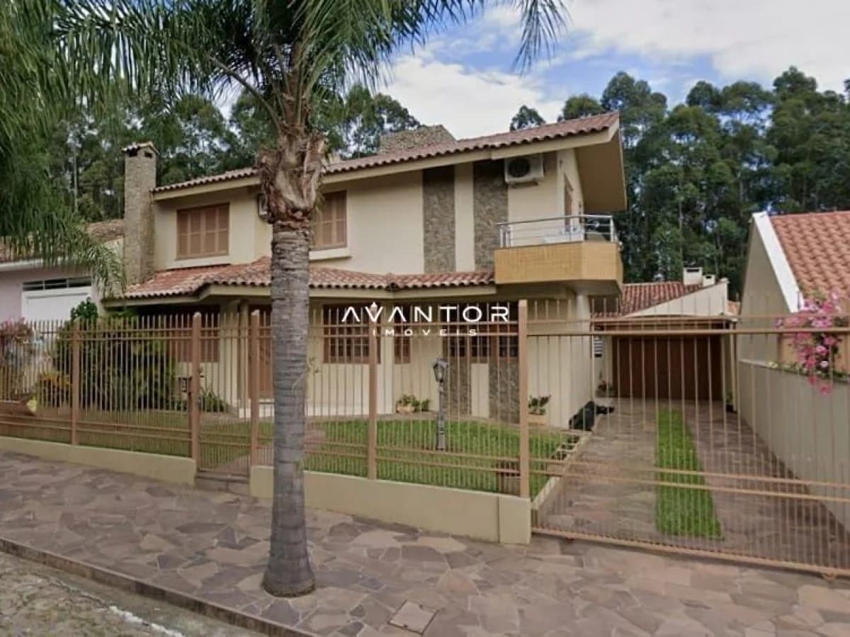 Fachada da casa com palmeira — Casa com 3 quartos à venda em São José, Santa Maria/RS