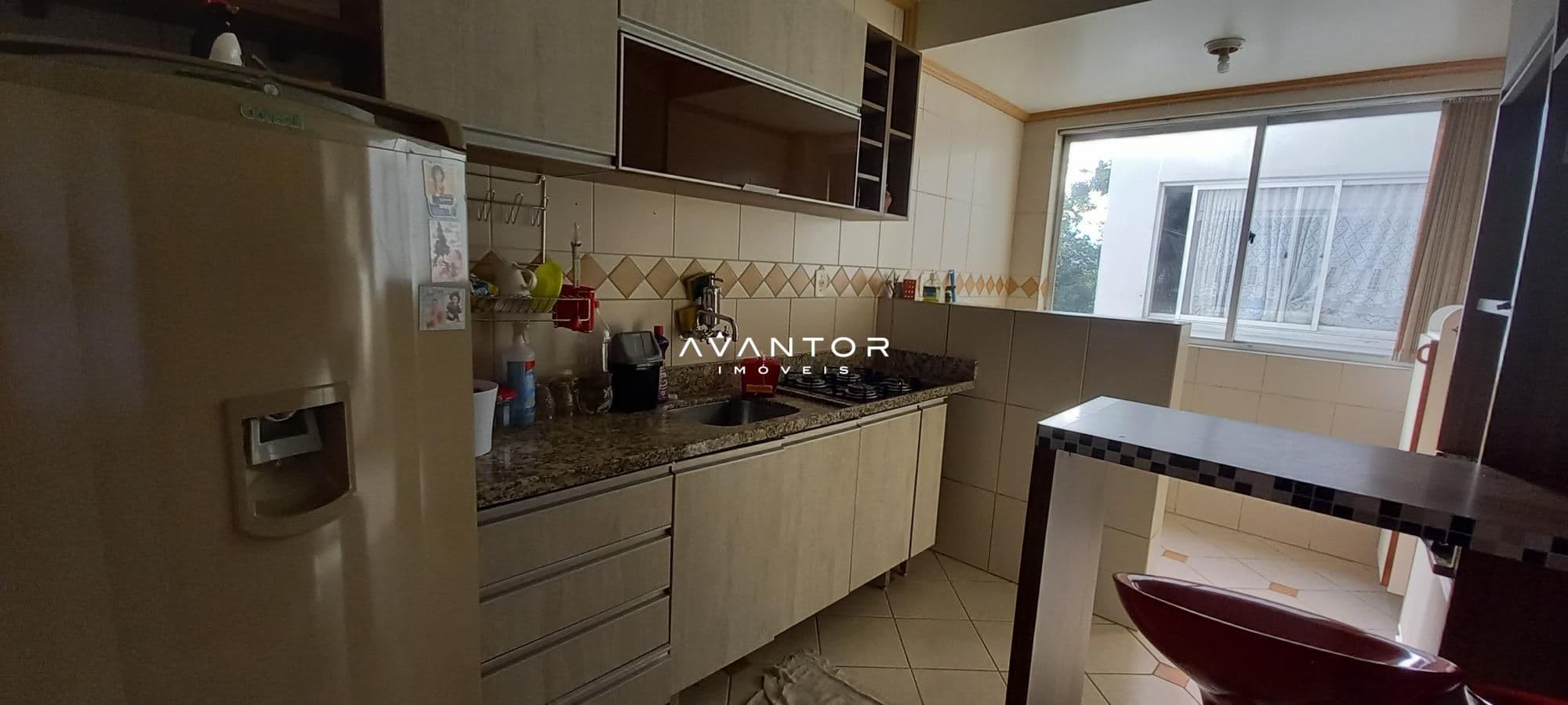 Cozinha com área de serviço — Apartamento com 3 quartos à venda no Edifício Ilha Bela, em Menino Jesus, Santa Maria/RS
