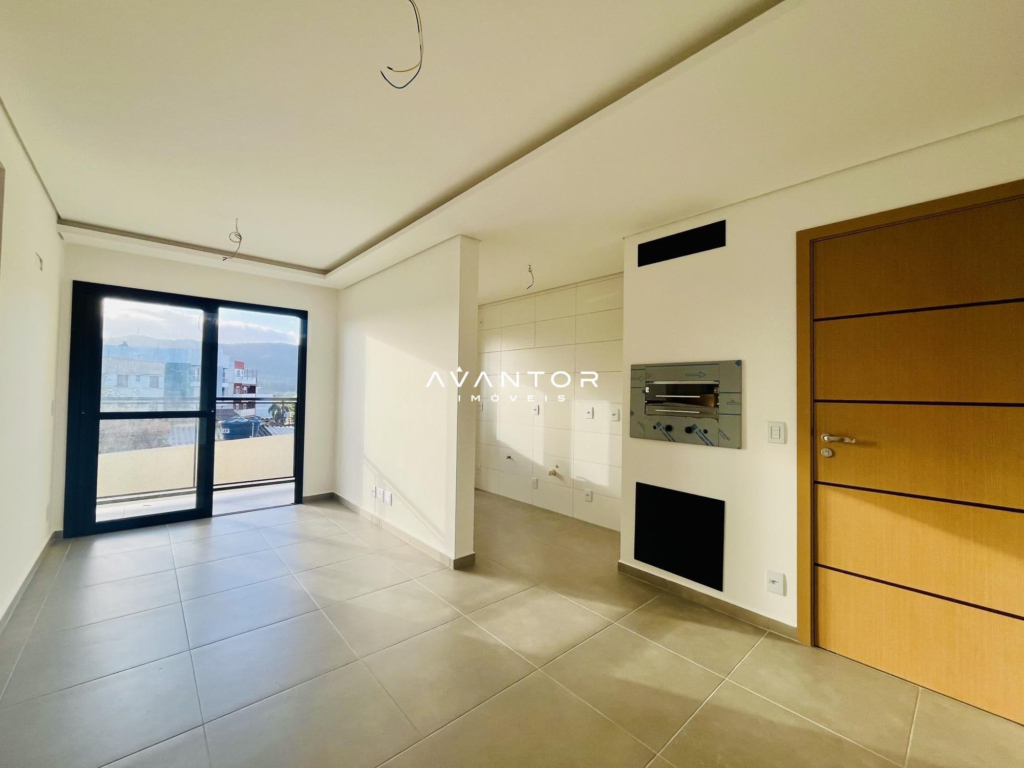 Sala integrada à cozinha com sacada — Apartamento com 2 quartos à venda em Nossa Senhora do Rosário, Santa Maria/RS