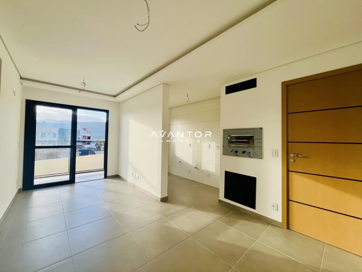 Sala integrada à cozinha com sacada — Apartamento com 2 quartos à venda em Nossa Senhora do Rosário, Santa Maria/RS