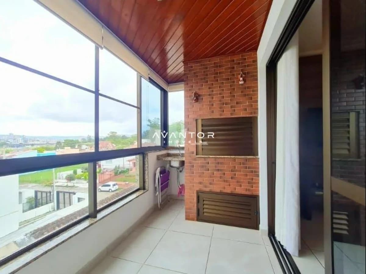 Sacada com vista panorâmica e parede de tijolos — Apartamento com 2 quartos à venda em Dom Antônio Reis, Santa Maria/RS