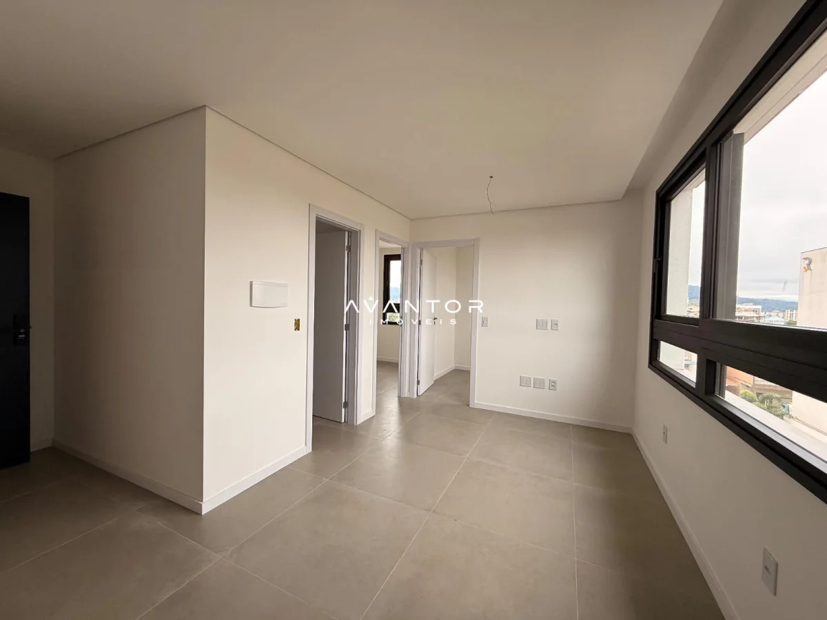 Sala de estar integrada à cozinha com sacada — Apartamento com 2 quartos à venda em Camobi, Santa Maria/RS