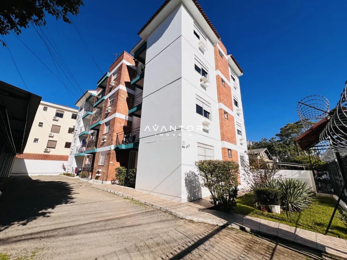 Fachada do prédio com tijolos aparentes — Apartamento com 2 quartos à venda em Camobi, Santa Maria/RS
