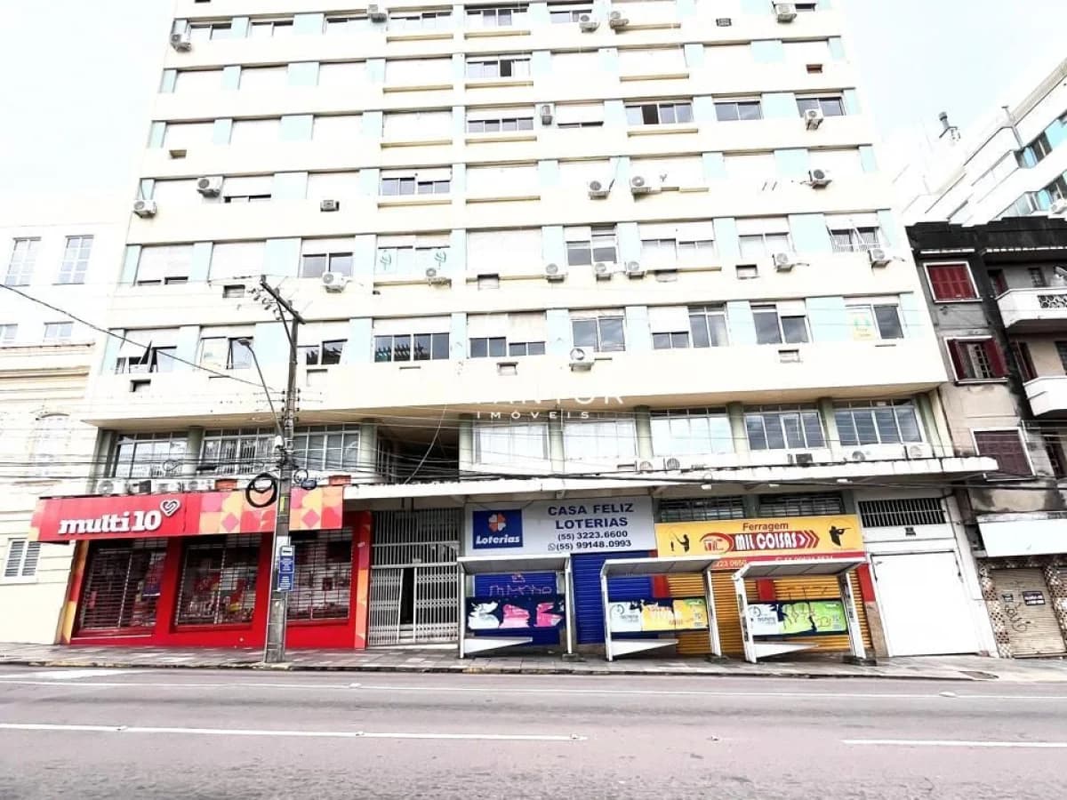 Fachada do prédio com comércios na base — Marechal Mascarenhas de Moraes, Pinheiro Machado, Santa Maria/RS