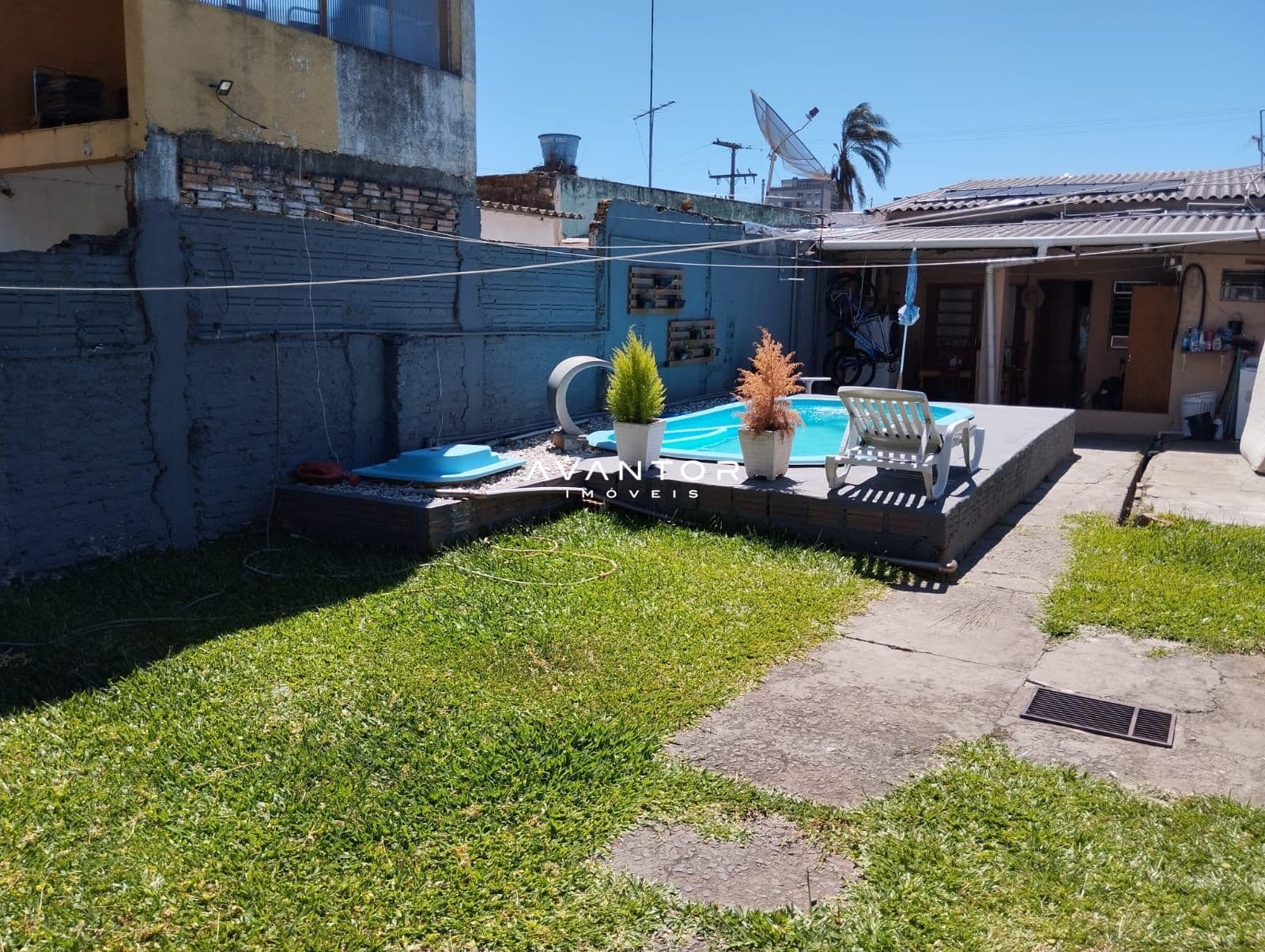 Pátio com piscina e área de lazer — Casa com 3 quartos à venda em Fluminense, Sant'Ana do Livramento/RS