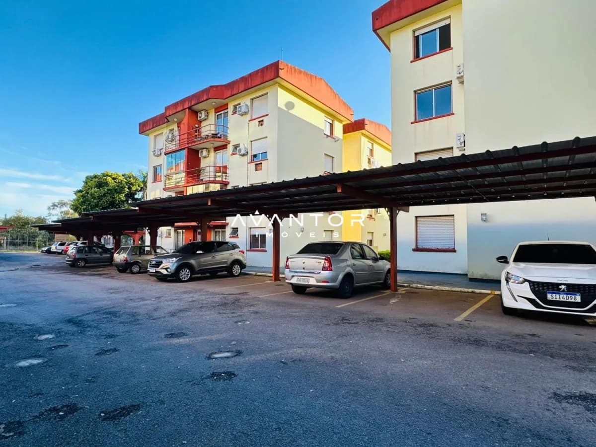 Fachada do prédio com garagem coberta — Apartamento com 2 quartos à venda em Nossa Senhora de Lourdes, Santa Maria/RS