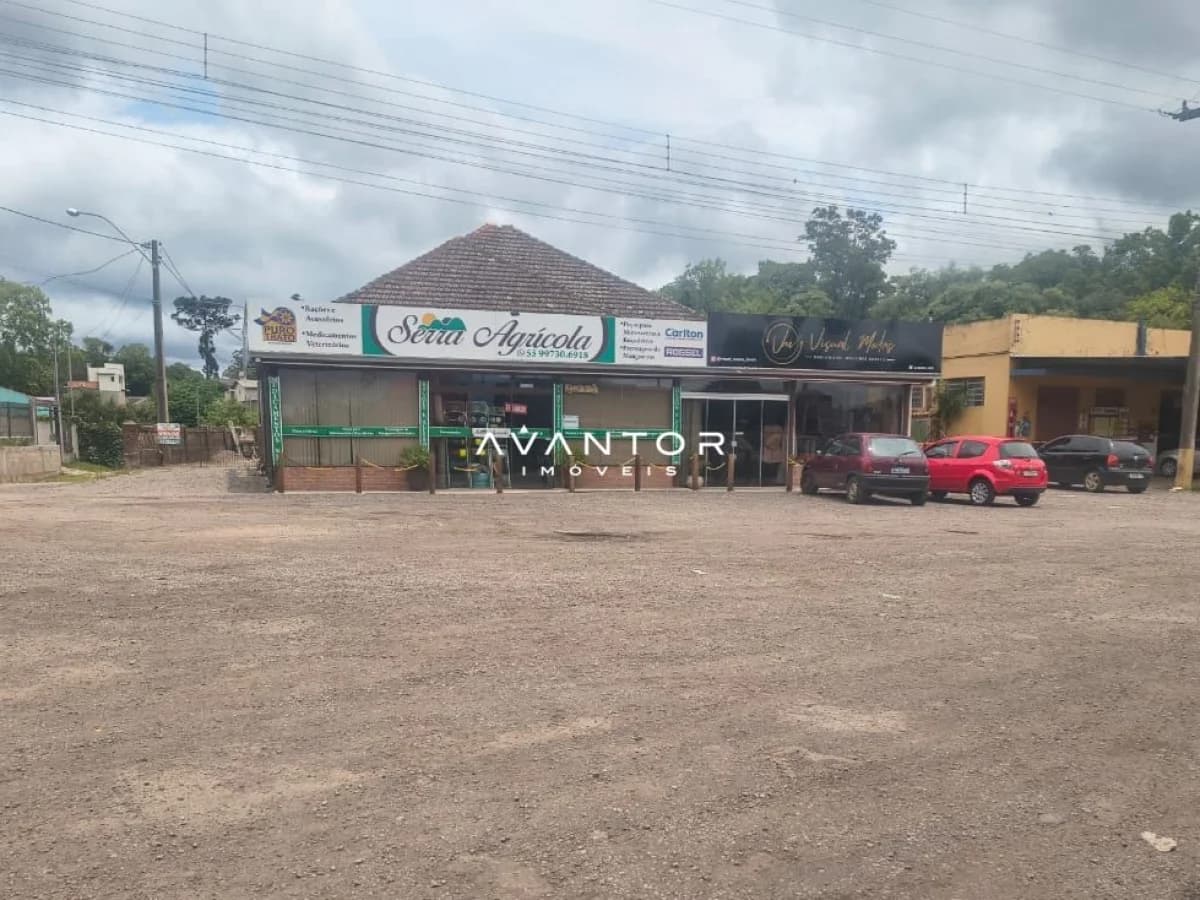 Fachada comercial com lojas e garagem — Terreno à venda em Parque Serrano I, Itaara/RS