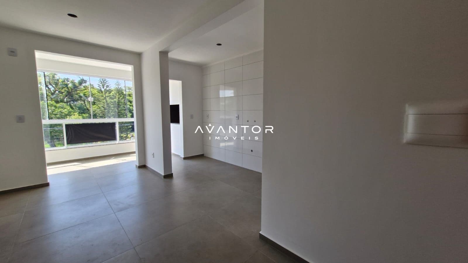 Sala integrada à cozinha com sacada — Apartamento com 2 quartos à venda em Nossa Senhora do Rosário, Santa Maria/RS