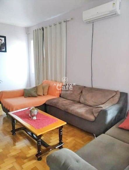 Sala de estar com sofá e mesinha de centro — Apartamento com 3 quartos à venda em Bonfim, Santa Maria/RS