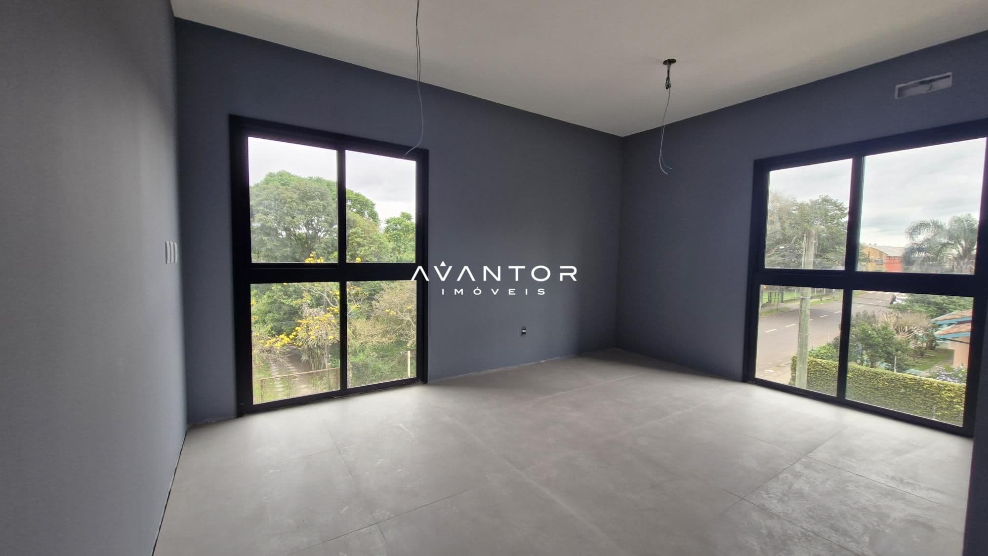 Sala com janelas e vista para área verde — Studio com 1 quarto à venda no Camobi Smart Living, em Camobi, Santa Maria/RS