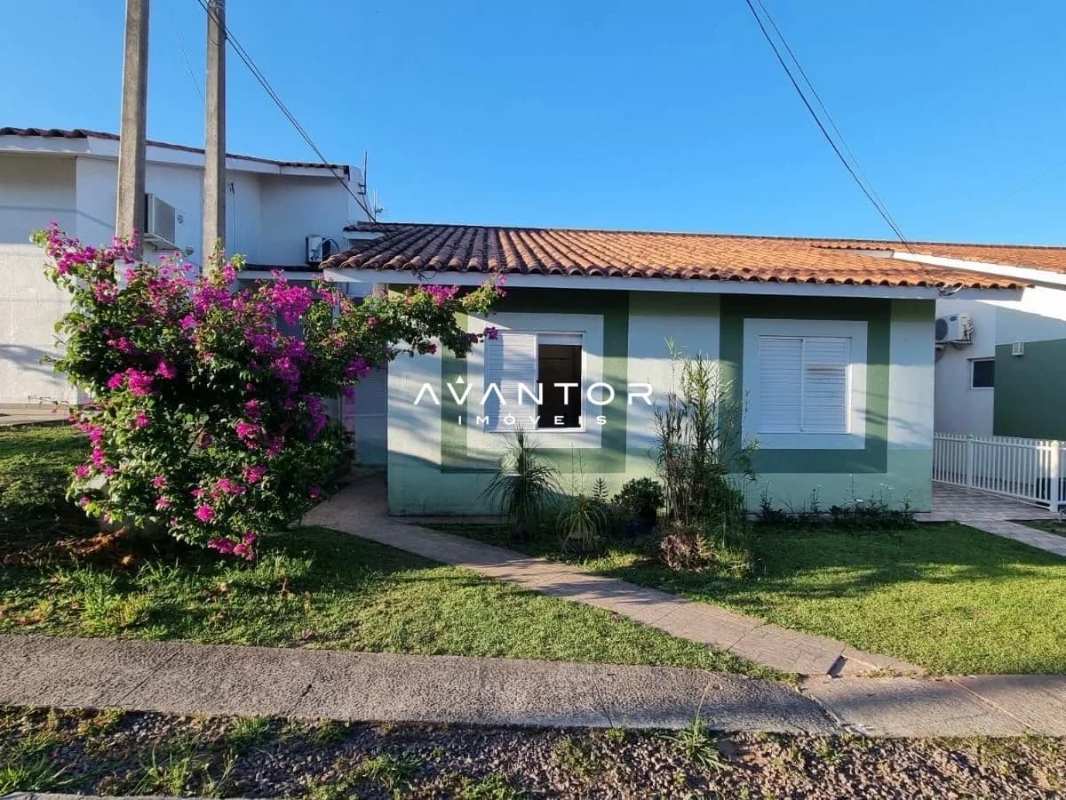 Fachada da casa com jardim frontal — Casa com 3 quartos à venda no Residencial Moradas Clube, em Cerrito, Santa Maria/RS