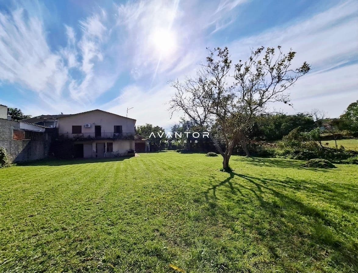 Fachada da casa com terreno — Terreno à venda em Camobi, Santa Maria/RS
