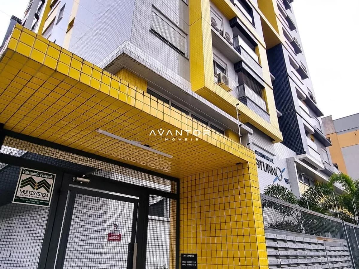 Fachada do prédio com acabamento em azulejo amarelo — Apartamento com 1 quarto à venda em Nossa Senhora de Fátima, Santa Maria/RS