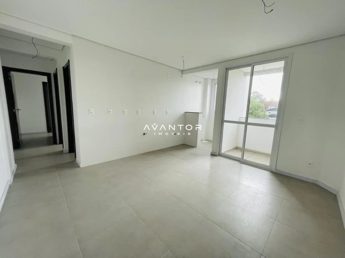 Sala de estar com acesso à sacada — Apartamento com 2 quartos à venda em Nossa Senhora de Lourdes, Santa Maria/RS