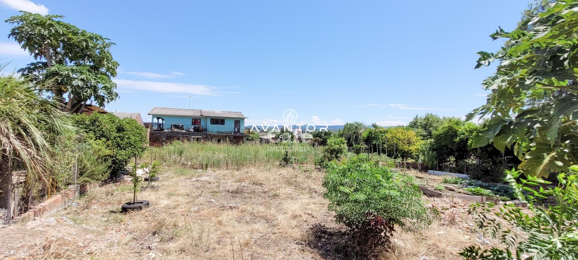 Fachada da casa com terreno — Terreno à venda em Pinheiro Machado, Santa Maria/RS