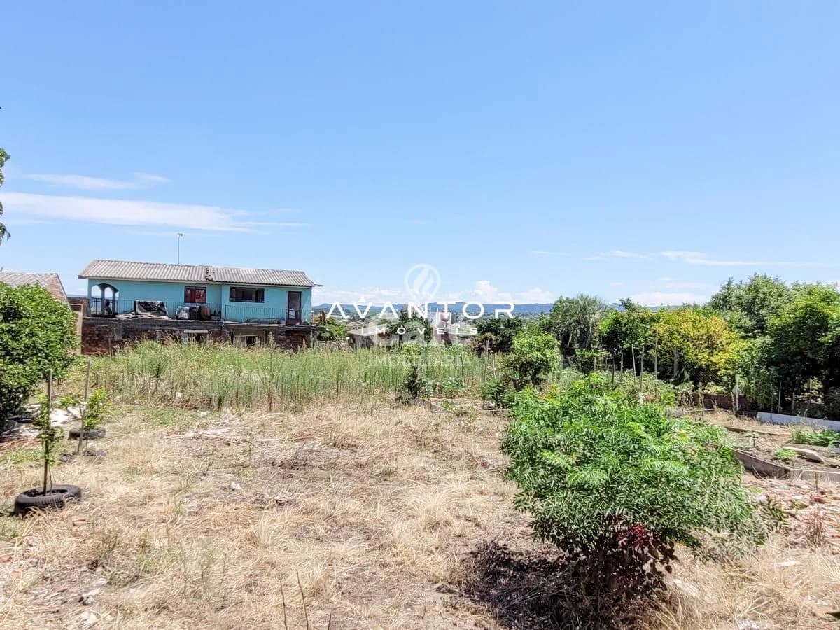 Fachada da casa com terreno — Terreno à venda em Pinheiro Machado, Santa Maria/RS