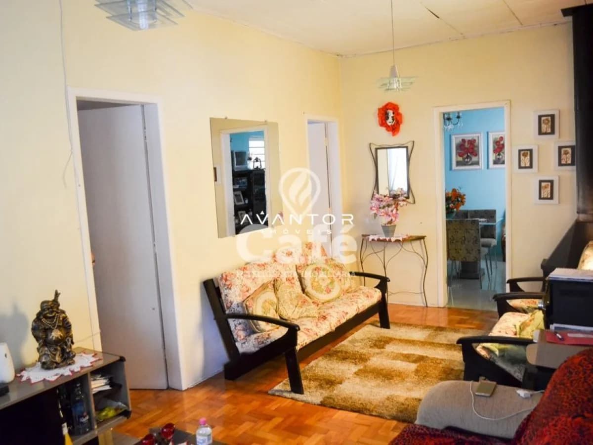Sala de estar com sofá e piso de madeira — Apartamento com 10 quartos à venda em Centro, Santa Maria/RS