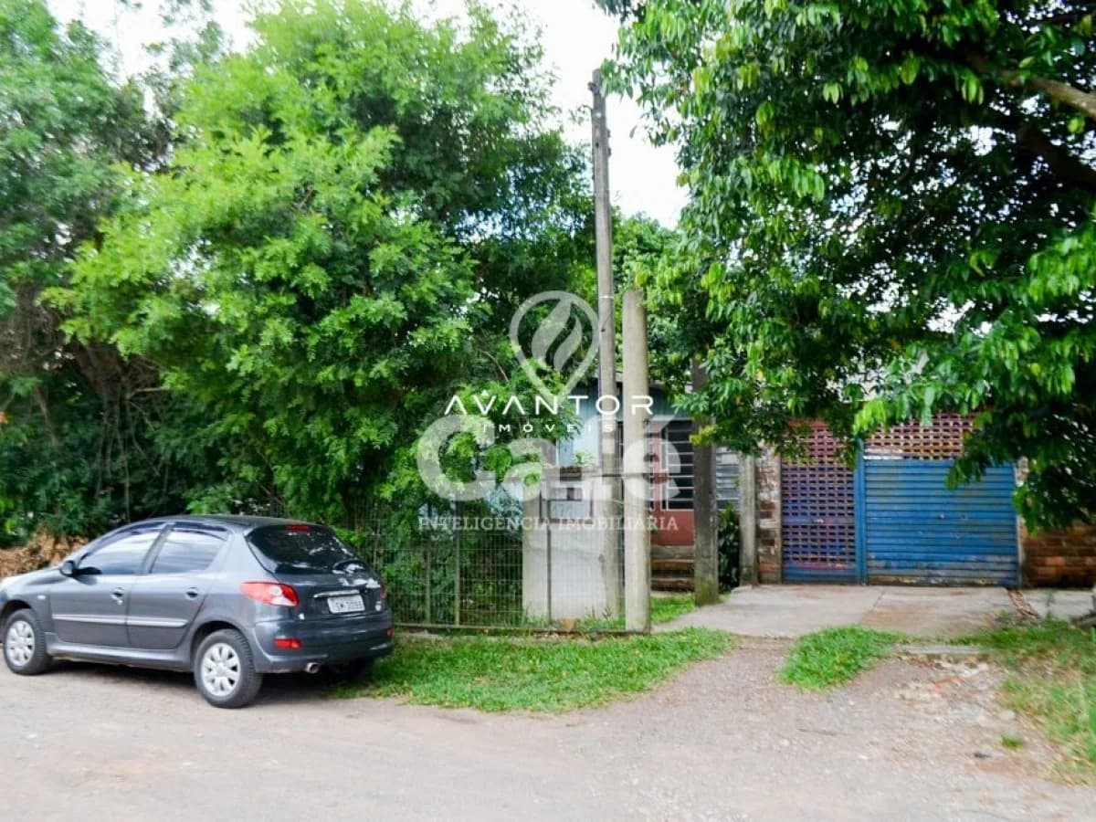 Fachada com garagem e acesso à propriedade — Terreno à venda em Boi Morto, Santa Maria/RS