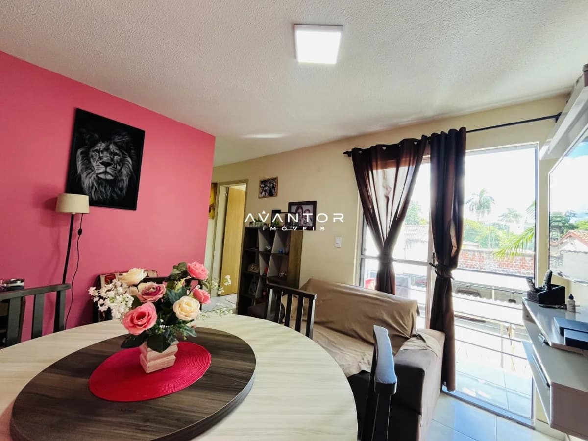 Sala de estar com parede rosa e sacada — Apartamento com 3 quartos à venda em Nossa Senhora do Rosário, Santa Maria/RS