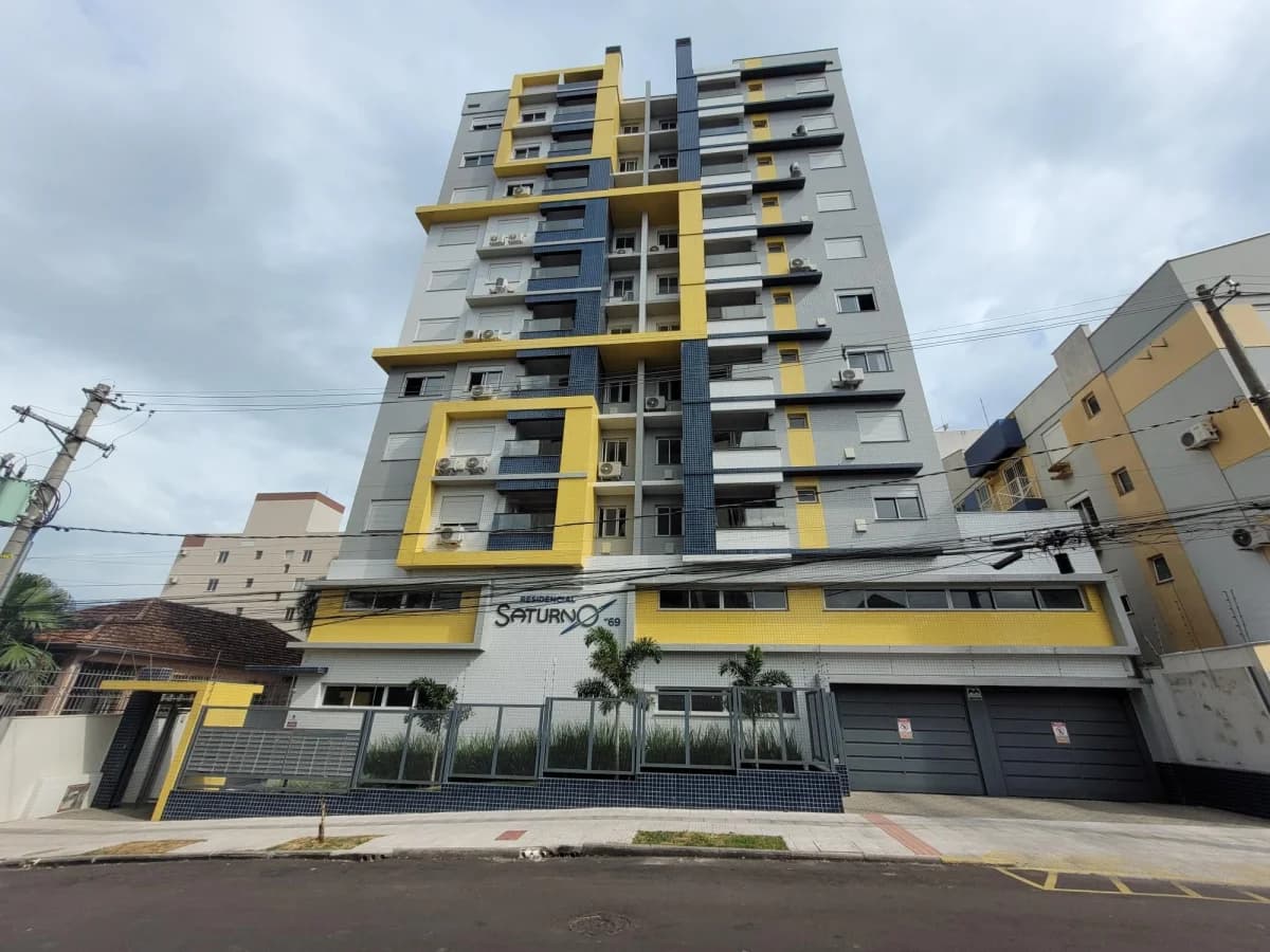 Fachada do prédio com acabamento em amarelo — Apartamento com 2 quartos para alugar em Nossa Senhora de Fátima, Santa Maria/RS