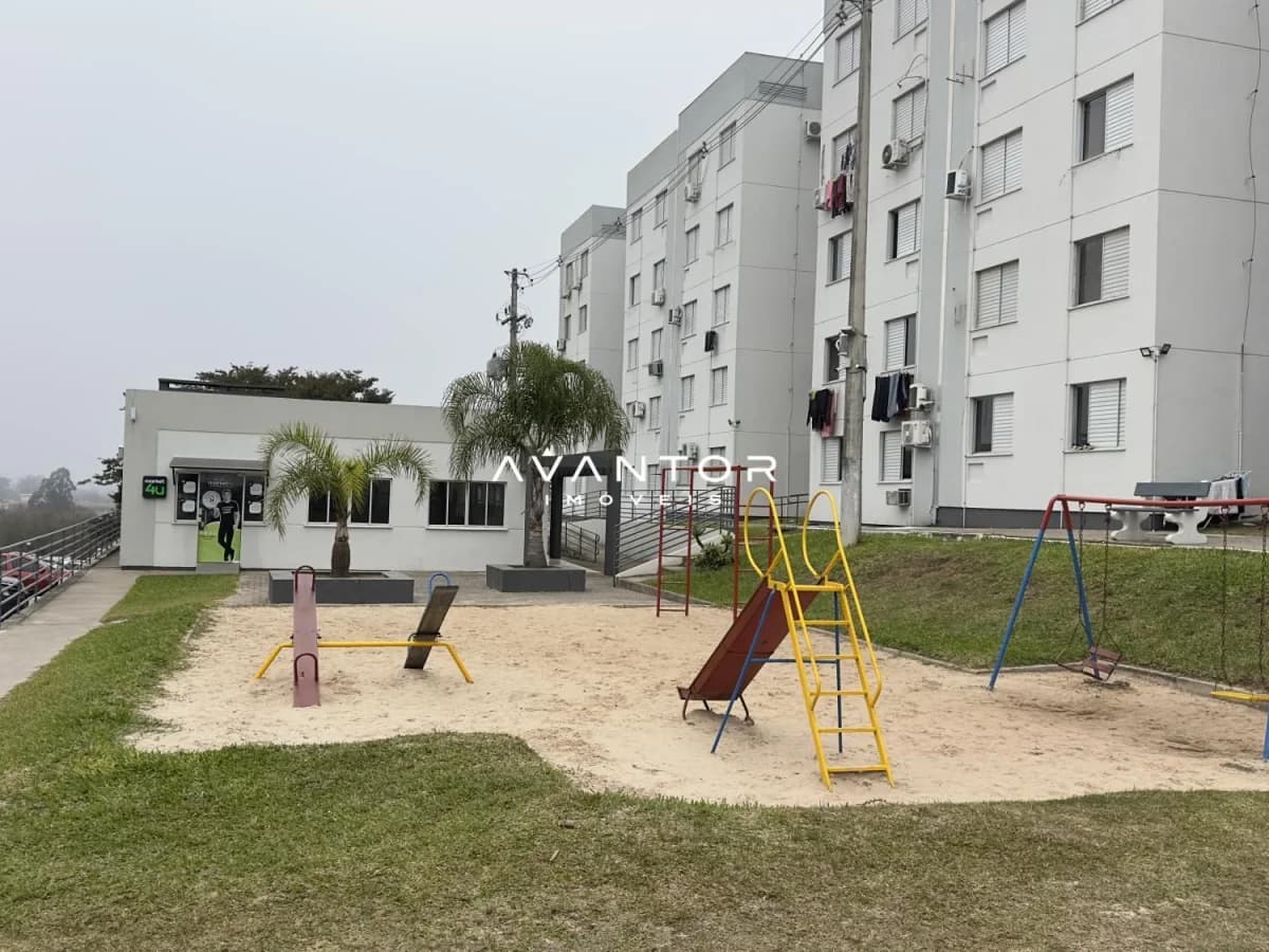 Área externa com parque infantil — Apartamento com 2 quartos à venda no Residencial Aruba, em Urlândia, Santa Maria/RS