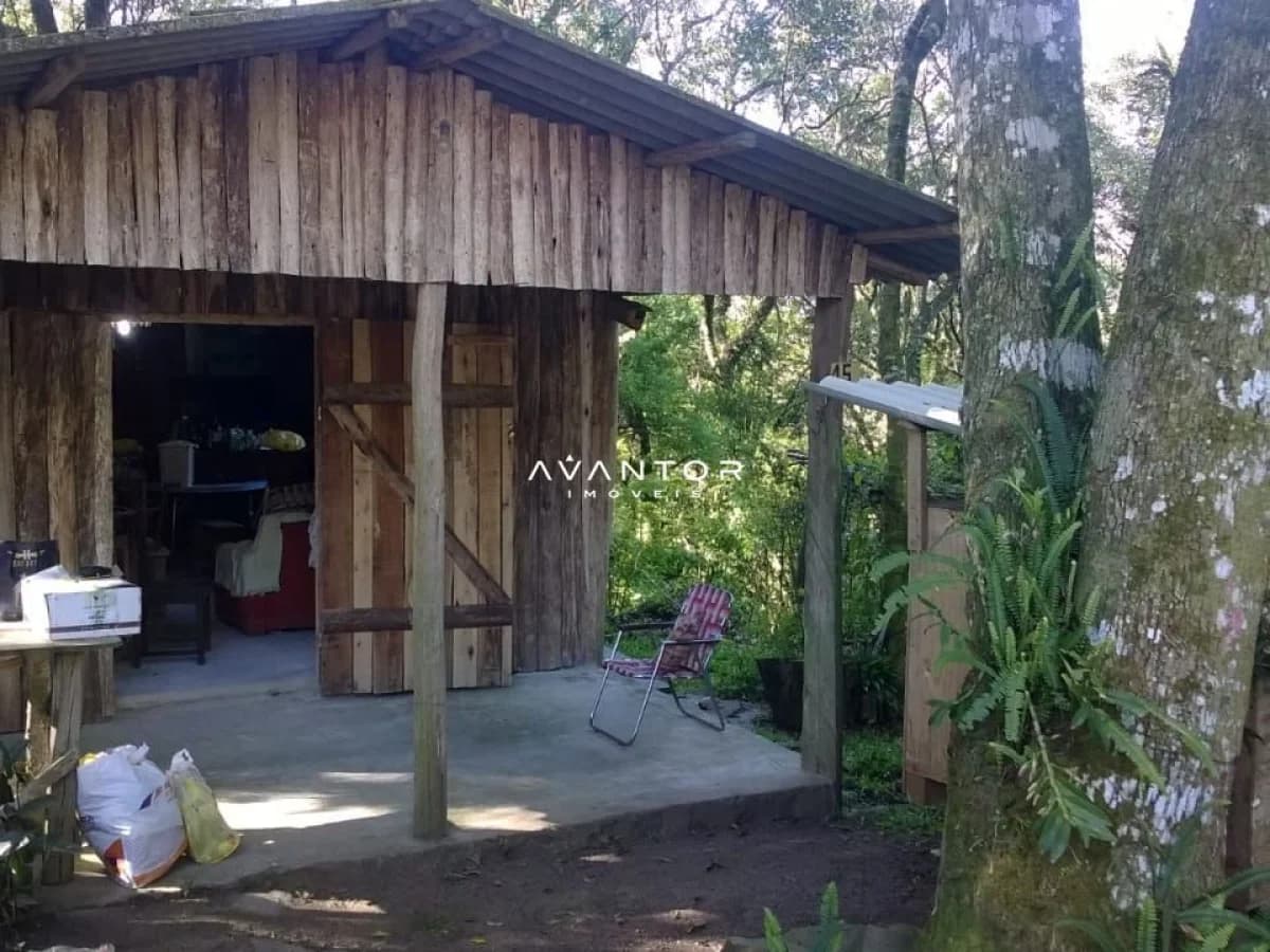 Fachada da casa com varanda — Terreno à venda em Parque Serrano I, Itaara/RS