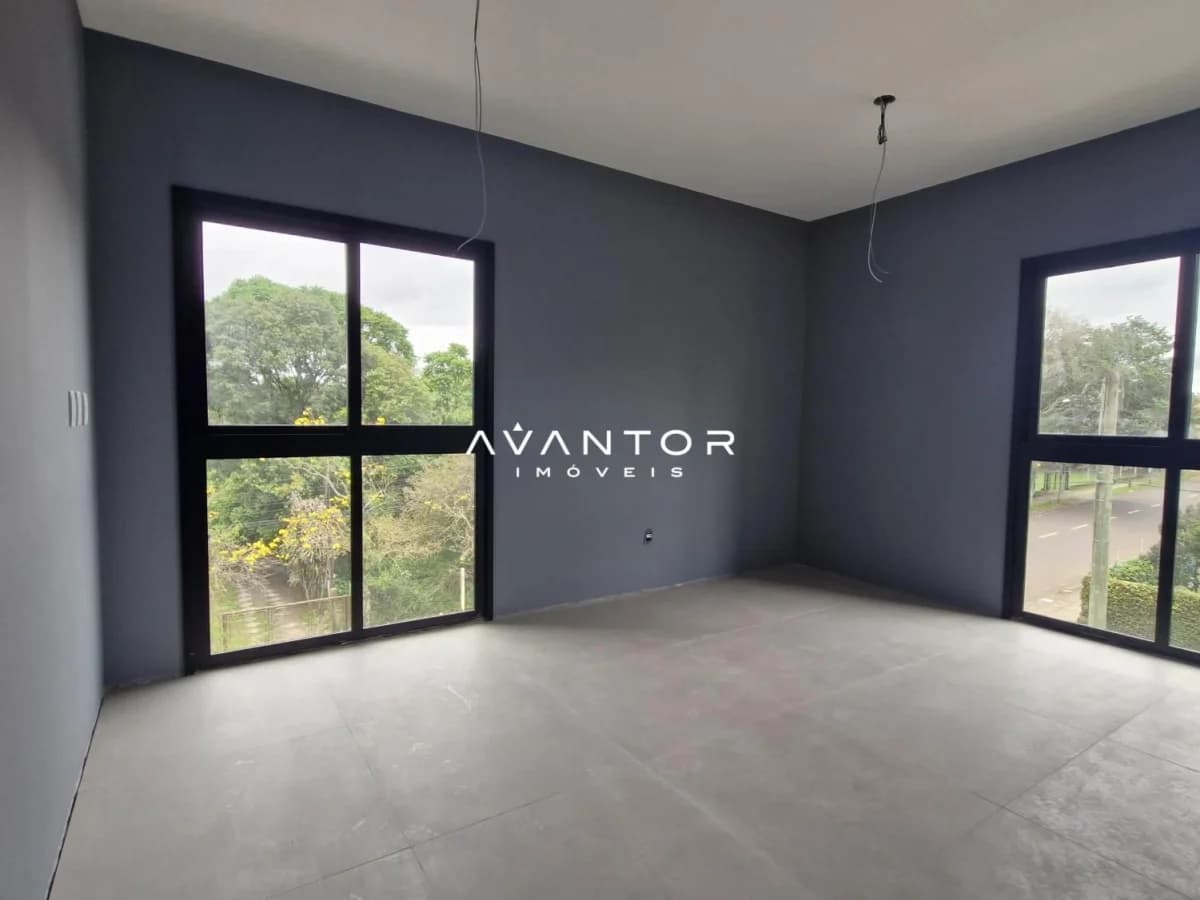 Sala com janelas e vista para área verde — Studio com 1 quarto à venda no Camobi Smart Living, em Camobi, Santa Maria/RS