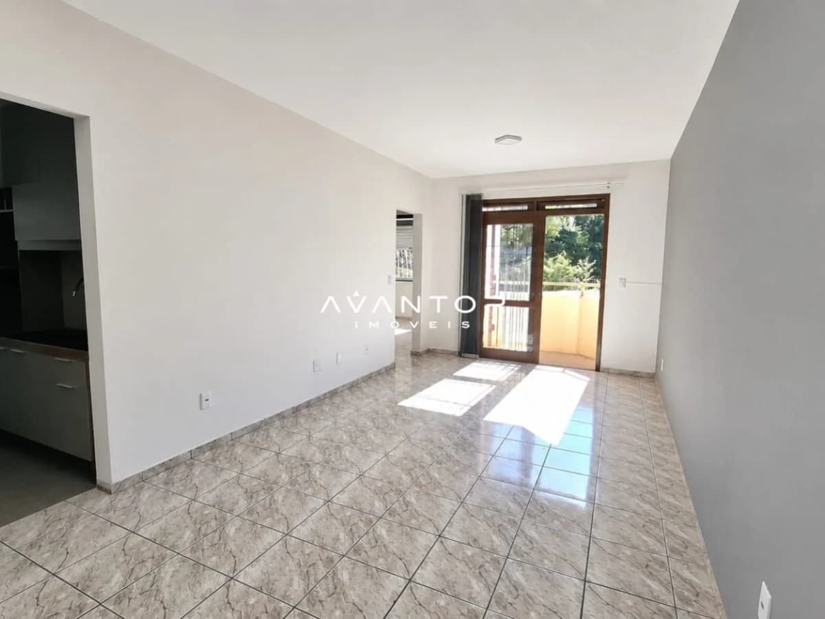 Sala de estar integrada à cozinha com sacada — Apartamento com 2 quartos à venda em Nossa Senhora de Fátima, Santa Maria/RS