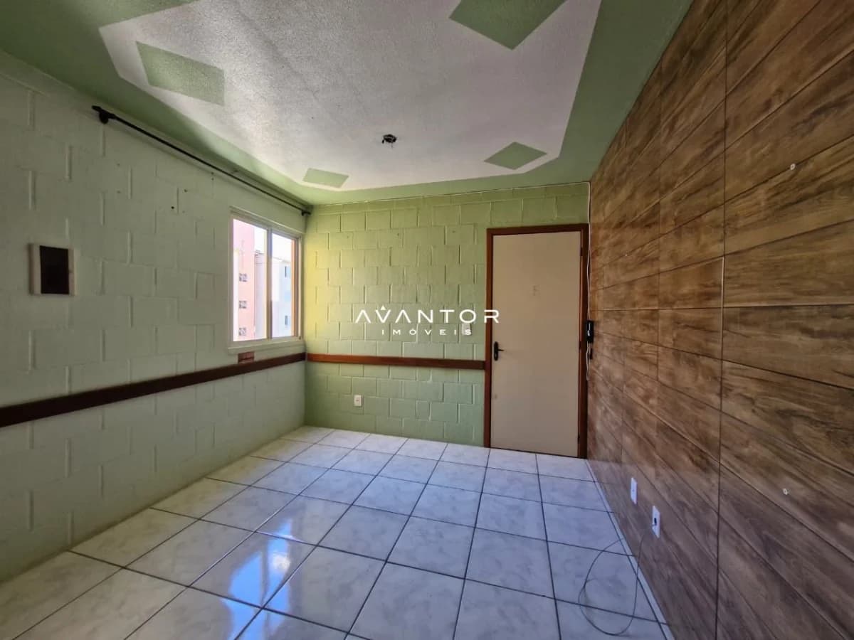 Dormitório com piso em cerâmica — Apartamento com 2 quartos à venda em Juscelino Kubitschek, Santa Maria/RS