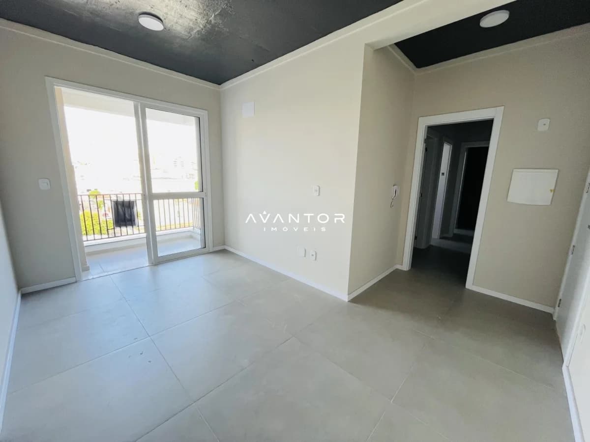 Sala integrada com sacada — Apartamento com 2 quartos para alugar no Residencial Regato, em Centro, Santa Maria/RS