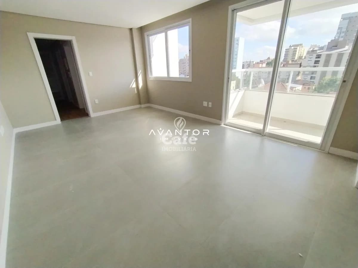 Sala de estar com sacada e vista para cidade — Apartamento com 2 quartos à venda em Centro, Santa Maria/RS